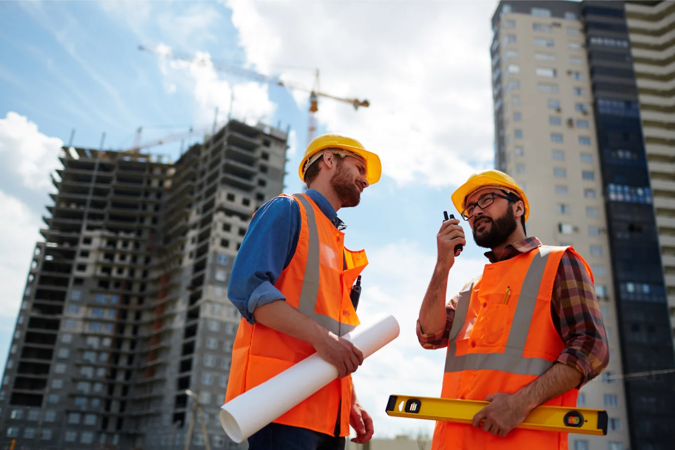 Team discussing window installation at job site